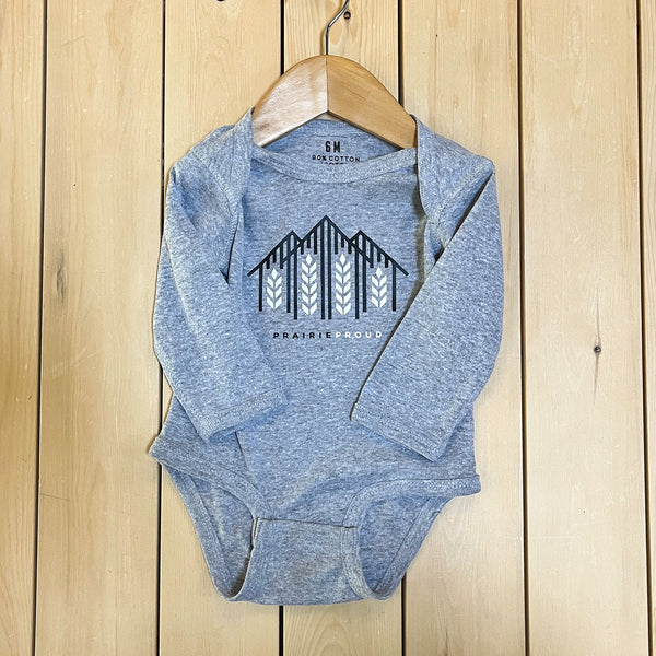 A heather grey long-sleeved onesie with a farmhouse design, displayed on a wooden hanger.
