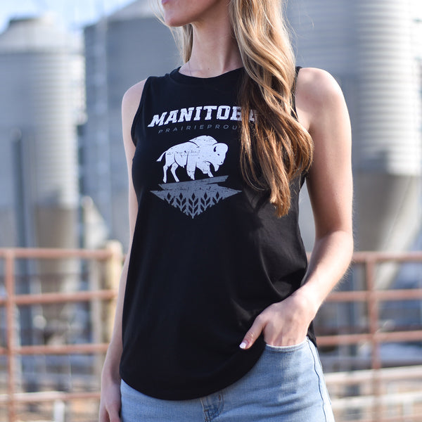 A woman wearing a black sleeveless tank top with 'MANITOBA' and 'prairie proud' with a bison graphic printed on the front.