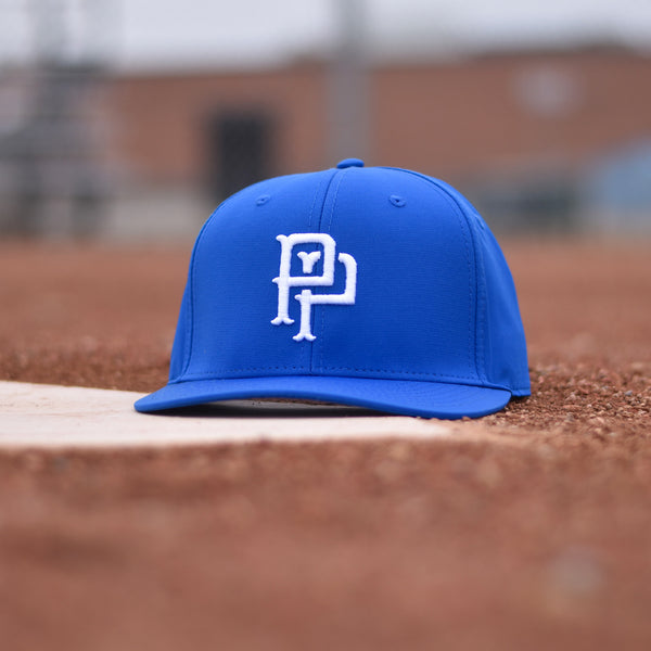 A royal blue snapback hat with white embroidery of a monogram on the front.