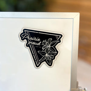 Magnet with the text 'prairie proud' and a triangular lily design.