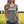 Woman wearing a greenish grey t-shirt with 'Prairie Proud' text in a field.
