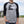 Person wearing a gray 3/4 sleeve shirt with black sleeves, the text 'Prairie Proud' and a grain elevator design.
