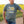 Man wearing a dusty green crew t-shirt with 'InVigor 30' logo in a field